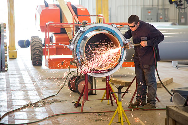 bolt-employee-fabricating-pipe